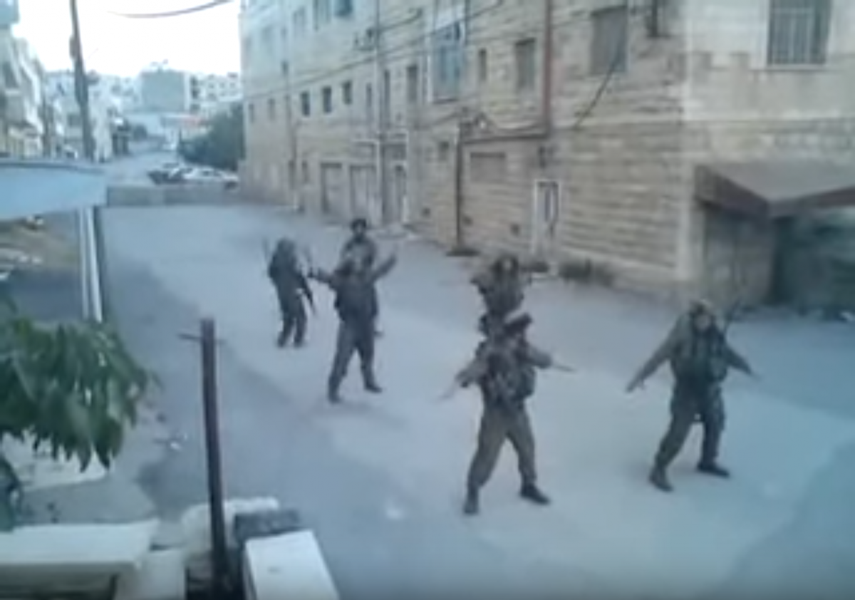 IDF soldiers dancing in the streets of Hebron (still from YouTube)