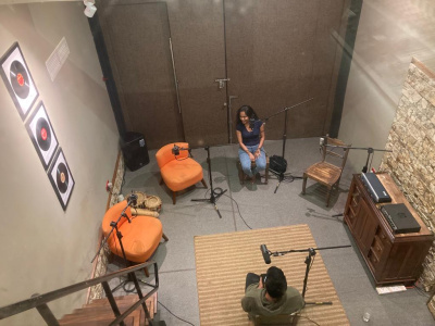 Musician and performer Dinupa Kodagoda speaking about her practice at the recording for the TIMEZONES podcast (photo: Devana Senanayake).